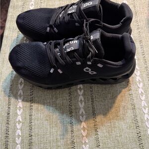 On Running Black Athletic Shoes with Cushioned Support